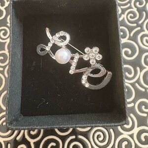 Elegant Silver 'Love' Brooch with Pearl Accent